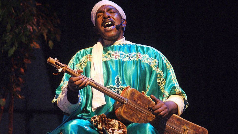 The Gnawa Master Musicians of Morocco performing on stage