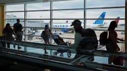 ARLINGTON, VIRGINIA - AUGUST 08: Passengers walk between terminals at Ronald Reagan Washington National Airport on August 08, 2023 in Arlington, Virginia. Severe thunderstorms pounded parts of the Eastern and Southern United States, causing widespread damage and delaying or cancelling more than 1,200 flights. (Photo by Chip Somodevilla/Getty Images)