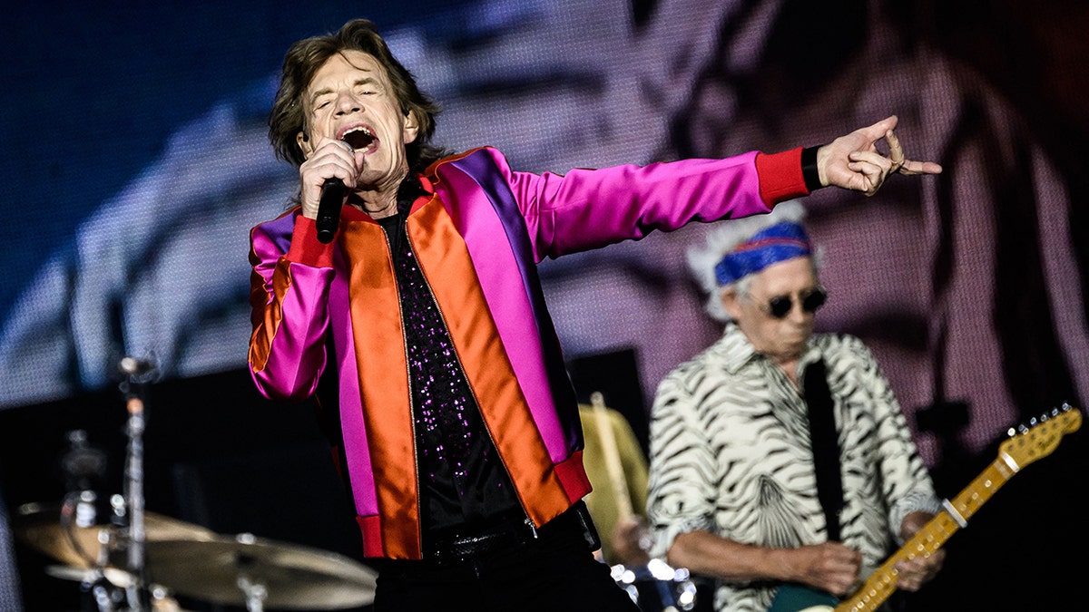 Mick Jagger singing into microphone