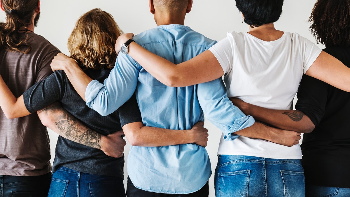 A group of friends with their arms around each other