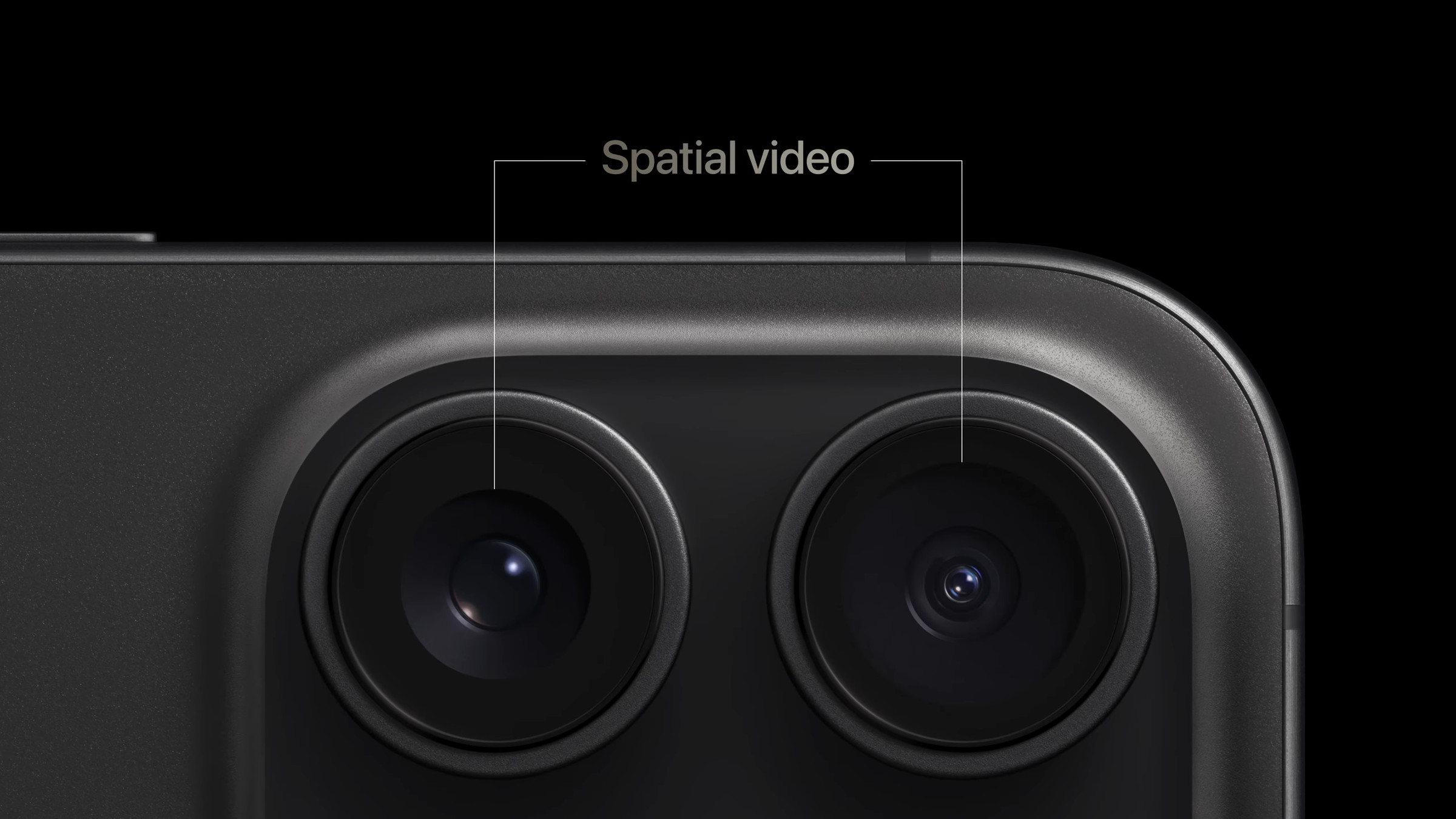 A close-up shot of the main and ultrawide cameras on an iPhone 15 Pro device.