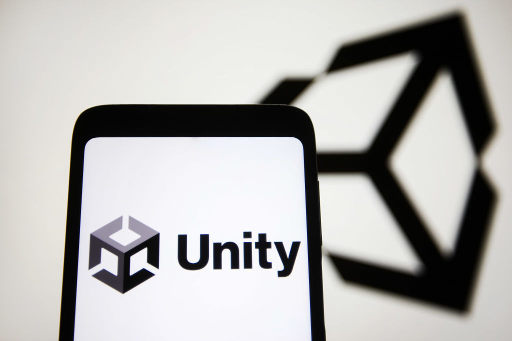 In this photo illustration, the Unity Technologies (Unity...