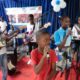 Haitian students play drums and strum guitars to escape hunger and gang violence