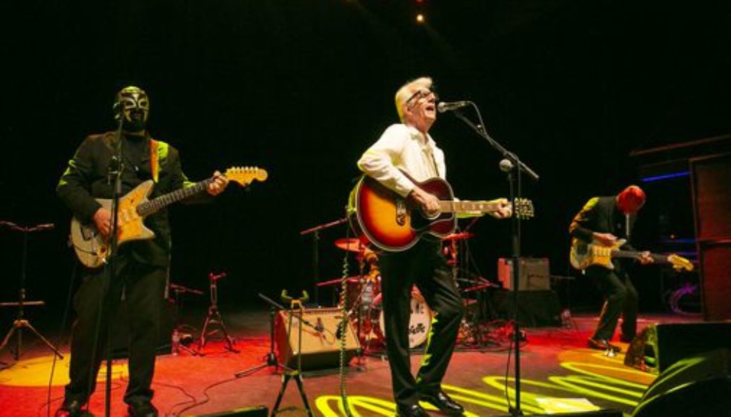 Nick Lowe on Christmas music, his masked accomplices, and why he had to change his tune - The Boston Globe