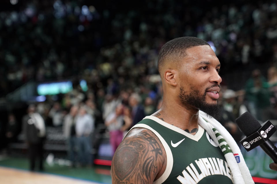 MILWAUKEE, WISCONSIN - OCTOBER 26: Damian Lillard #0 of the Milwaukee Bucks is interviewed after the Bucks defeated the Philadelphia 76ers 118-117 at Fiserv Forum on October 26, 2023 in Milwaukee, Wisconsin. NOTE TO USER: User expressly acknowledges and agrees that, by downloading and or using this photograph, User is consenting to the terms and conditions of the Getty Images License Agreement. (Photo by Patrick McDermott/Getty Images)