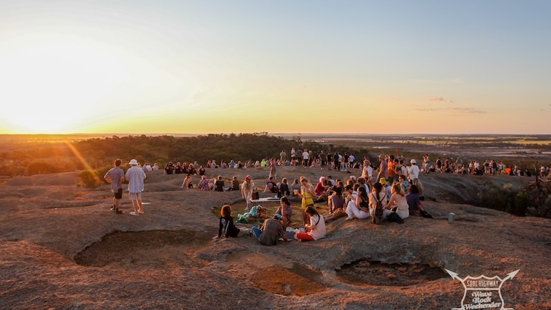 Wave Rock patrons on top of the rock.