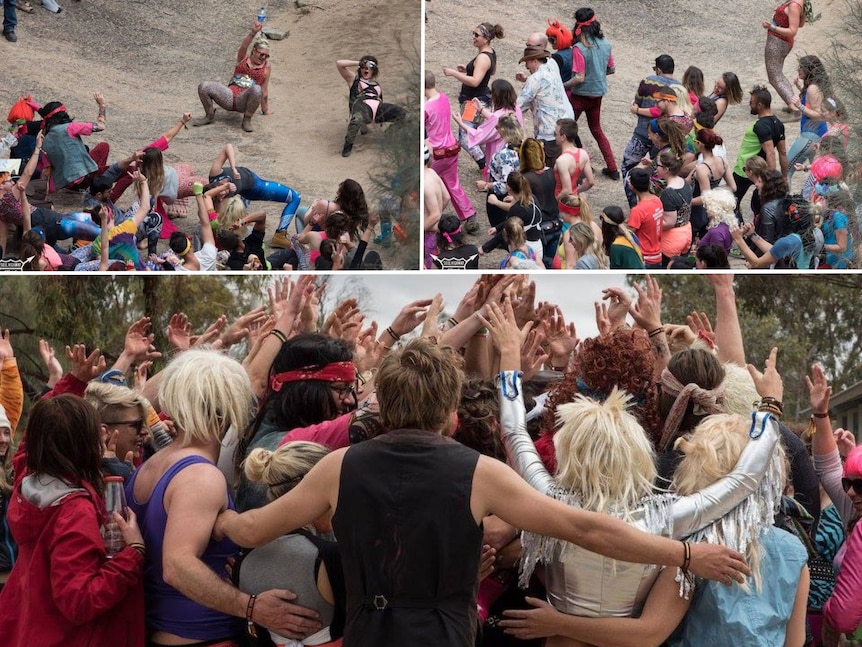 Young people gathered on a rock, having fun.