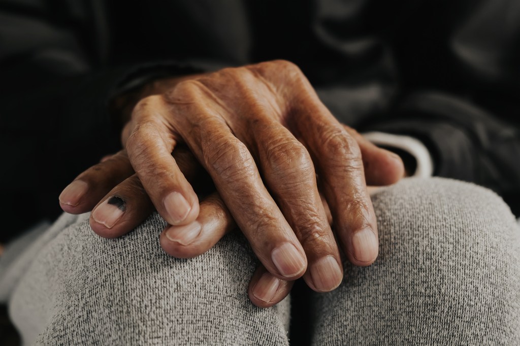 Close up of male wrinkled hands, old man 