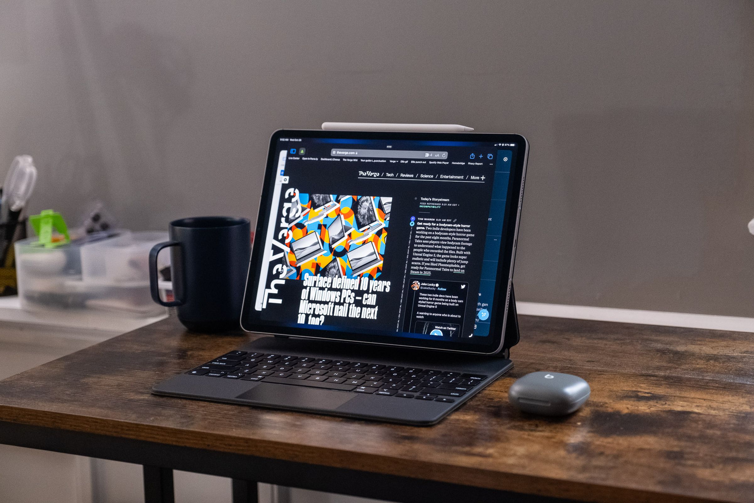 A 2022 Apple iPad Pro in a Magic Keyboard case on a wooden desk.