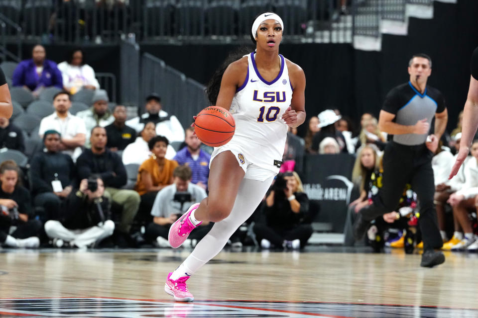 Nov 6, 2023; Las Vegas, Nevada, USA; LSU Lady Tigers forward Angel Reese (10) dribbles against the Colorado Buffaloes during the first quarter at T-Mobile Arena. Mandatory Credit: Stephen R. Sylvanie-USA TODAY Sports