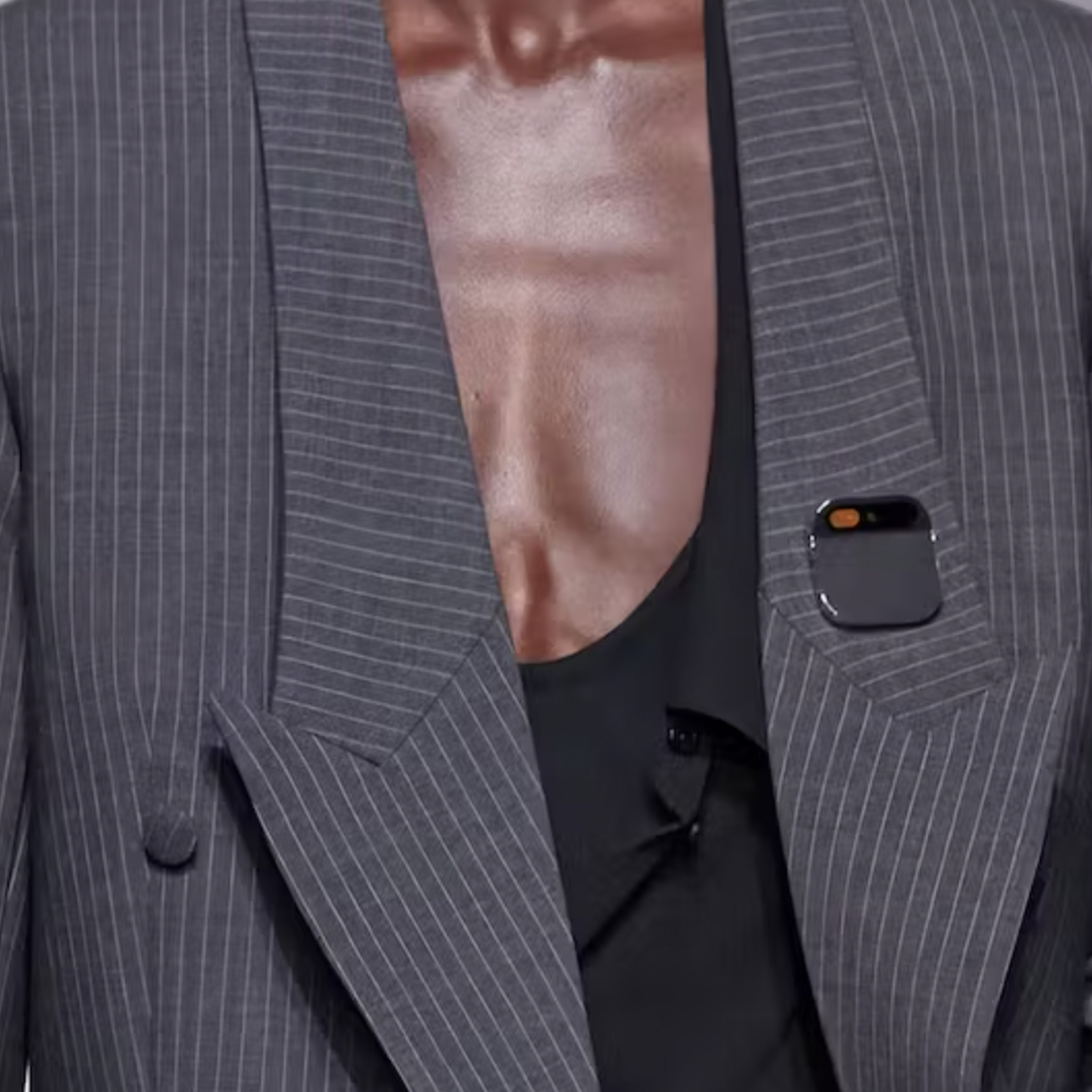 A photo showing Humane’s AI pin attached to a model’s suit during a fashion show.