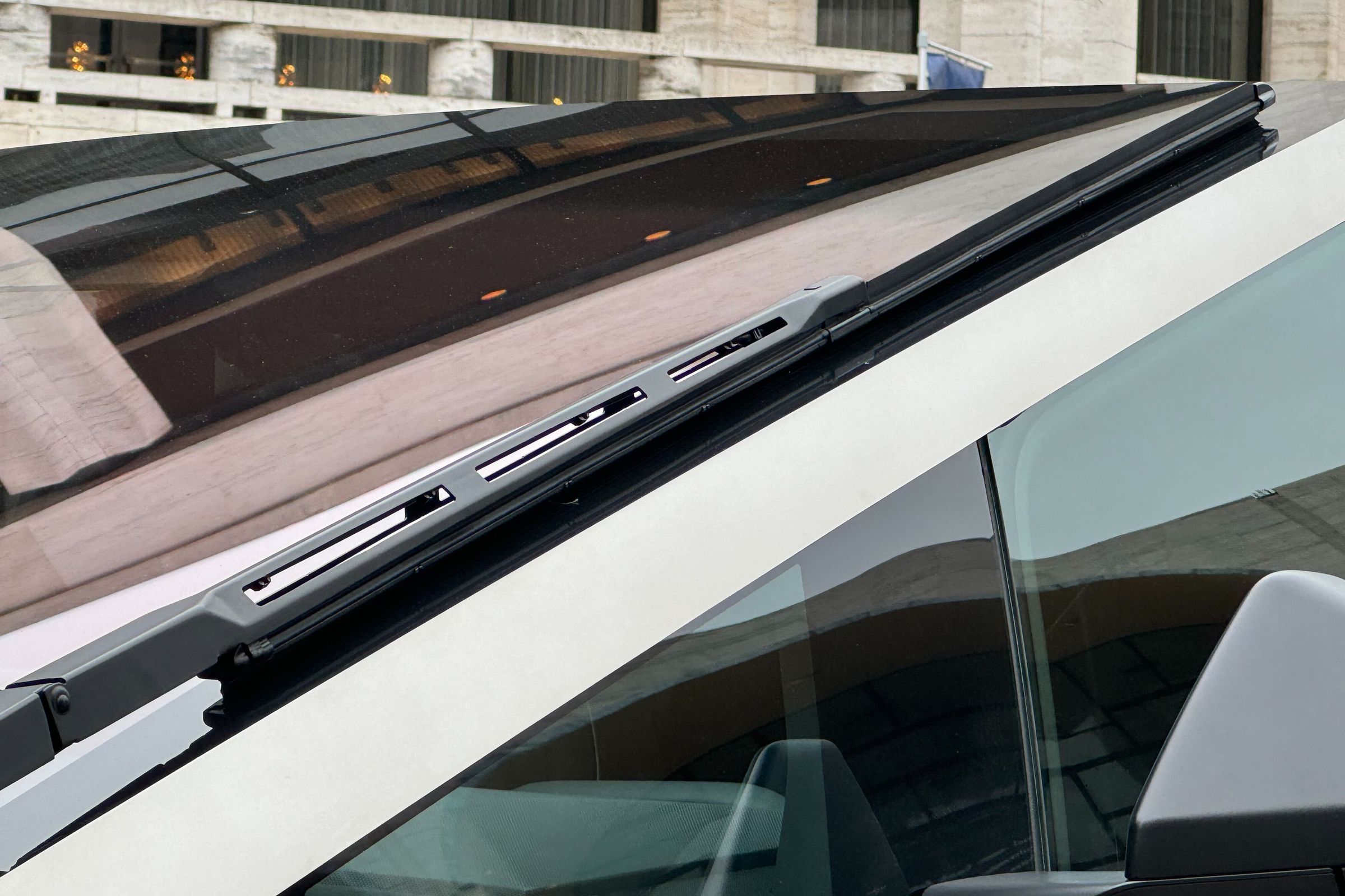 A close-up shot of the Tesla Cybertruck, focused on the wiper.