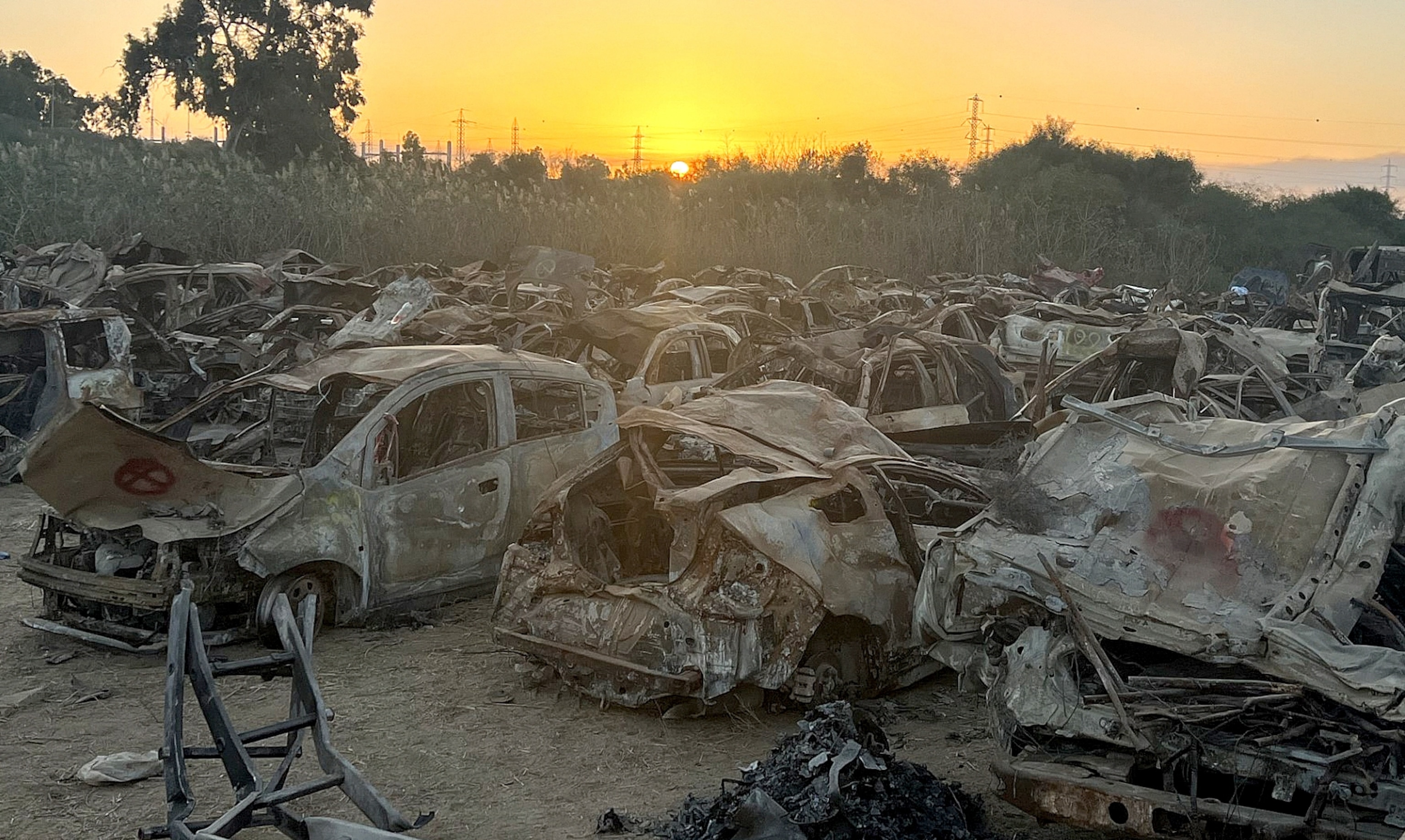 PHOTO: In a field near Netivot, Israel, hundreds of burnt-out vehicles were recovered from the scene of the deadly Supernova music festival massacre.