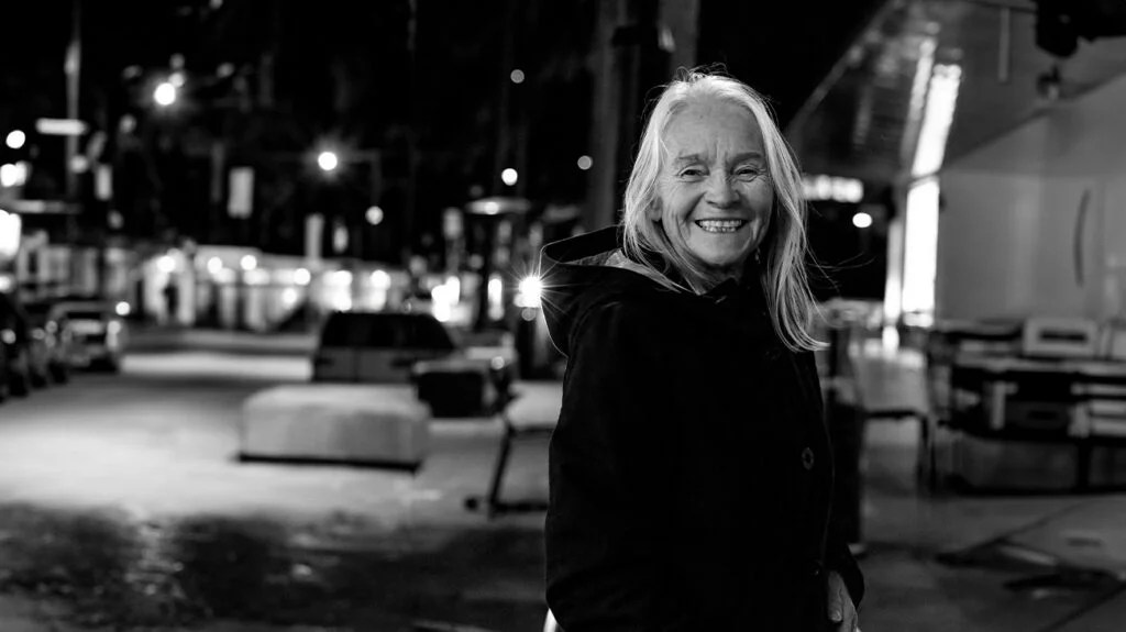 black and white photo of older woman smiling