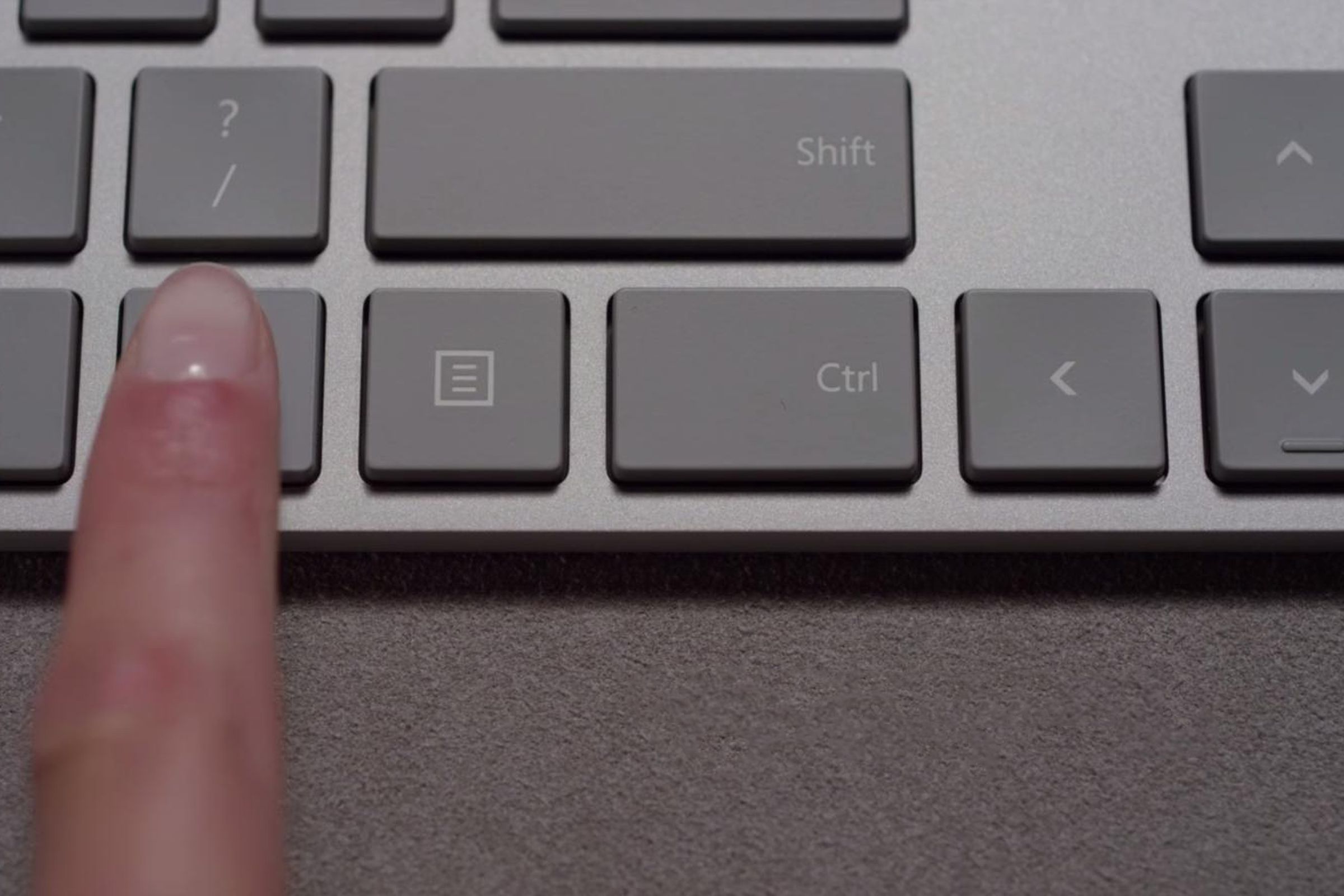 A finger on a Microsoft keyboard