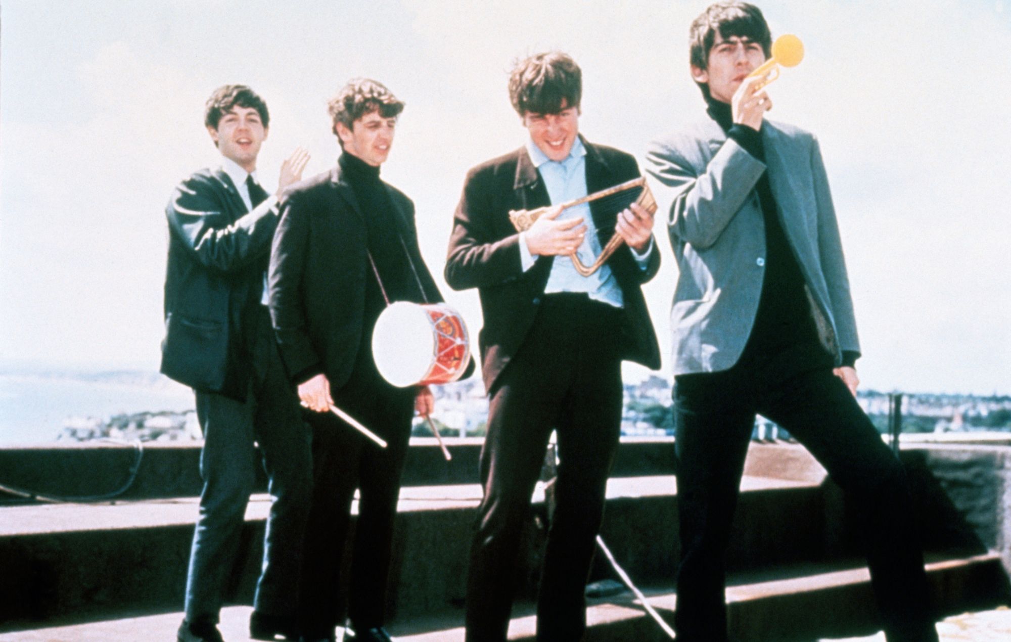 12/18/1964-London, England: The Beatles clown on a London rooftop, left to right: Paul McCartney, Ringo Starr, John Lennon, and George Harrison.