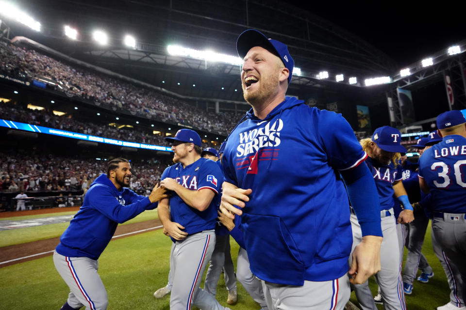 PHOENIX, AZ - NOVEMBER 01: Will Smith #51 of the Texas Rangers celebrates on the field after the Texas Rangers defeated the Arizona Diamondbacks in Game 5 of the 2023 World Series at Chase Field on Wednesday, November 1, 2023 in Phoenix, Arizona. (Photo by Mary DeCicco/MLB Photos via Getty Images)