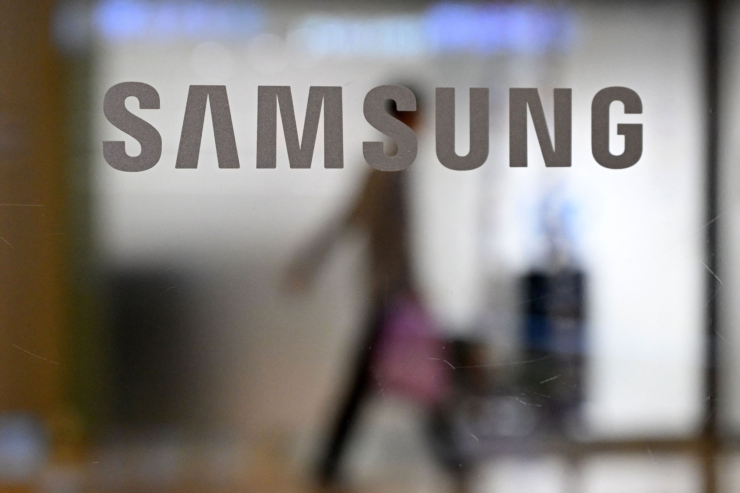 A Samsung logo on a glass door