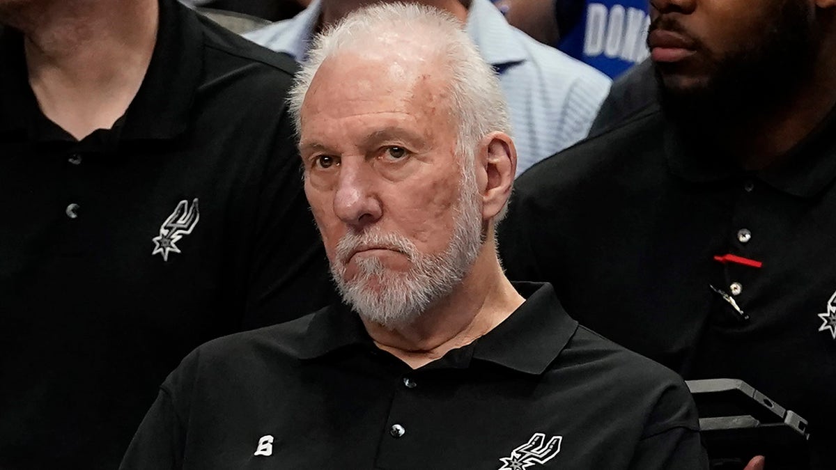 Gregg Popovich sits