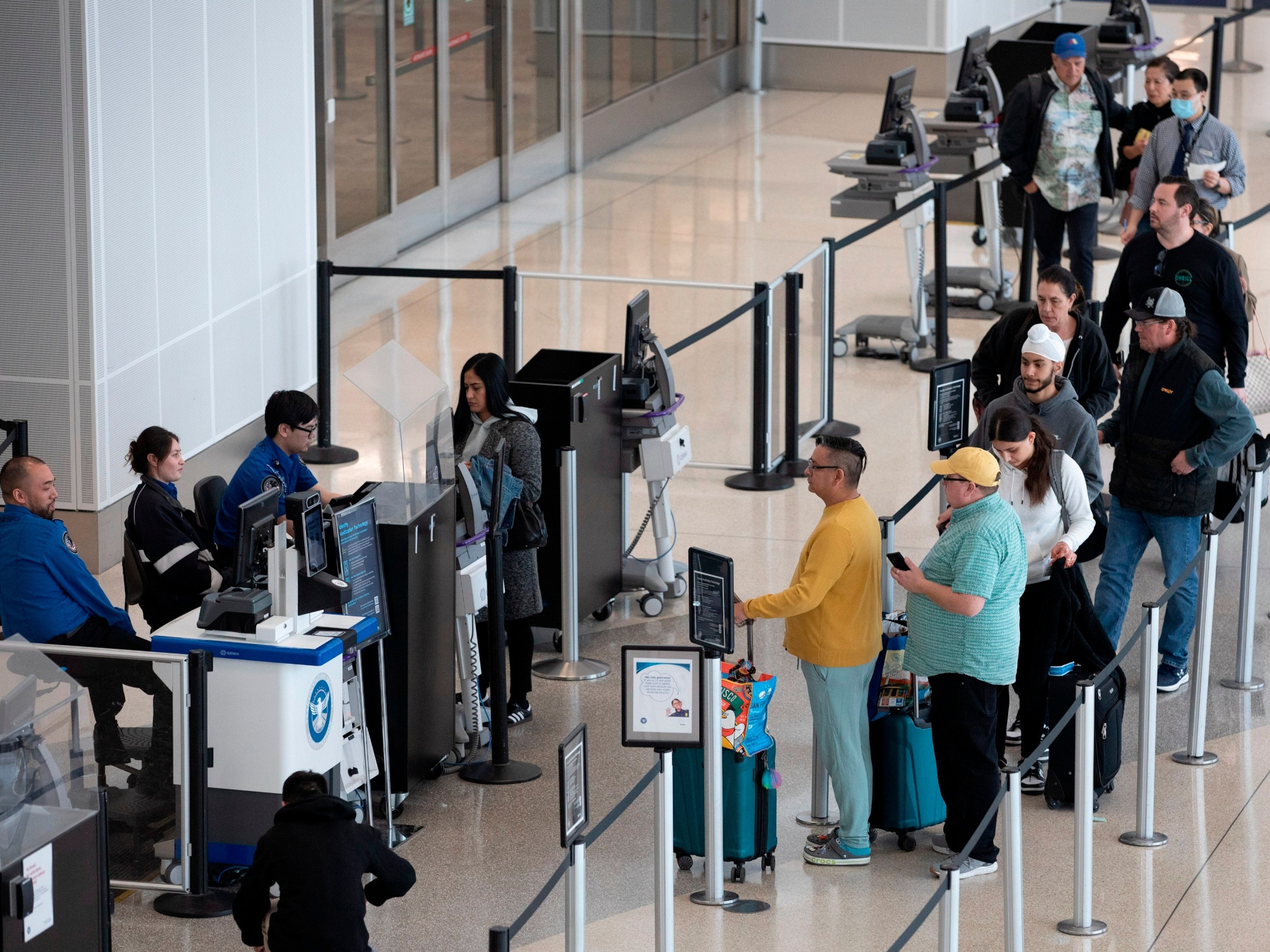 PHOTO: Passengers line up to pass through security at San Francisco International Airport Nov. 26, 2023. 