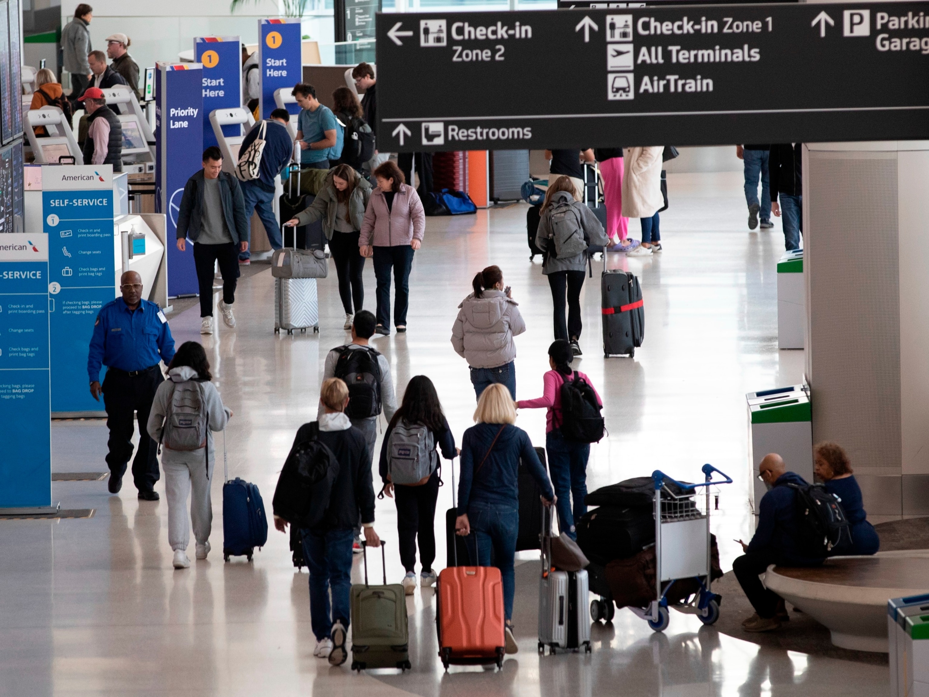 PHOTO: Passengers walk through the departures level at San Francisco International Airport Nov. 26, 2023. 