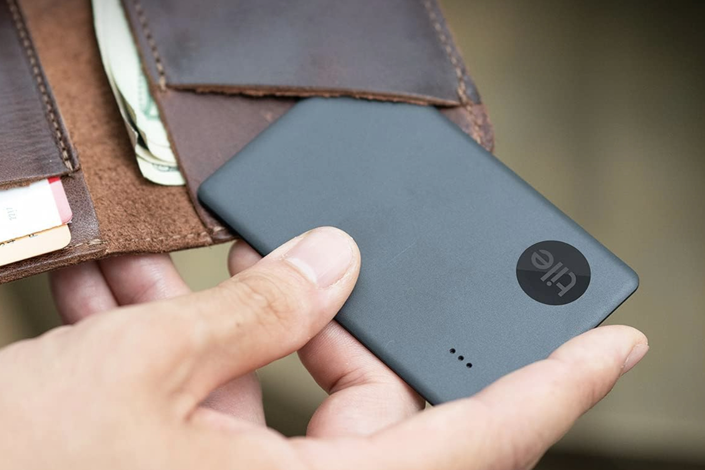 A photo of the Tile Slim tracker in a wallet.