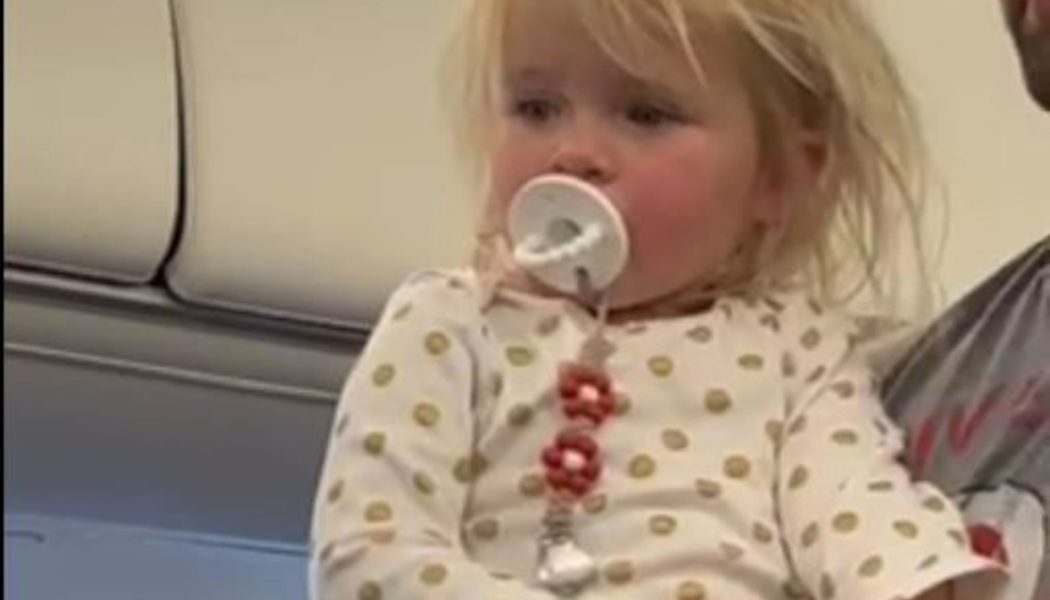 This toddler on a plane is all of us during holiday travel