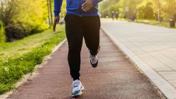 Young sporty man enjoys jogging