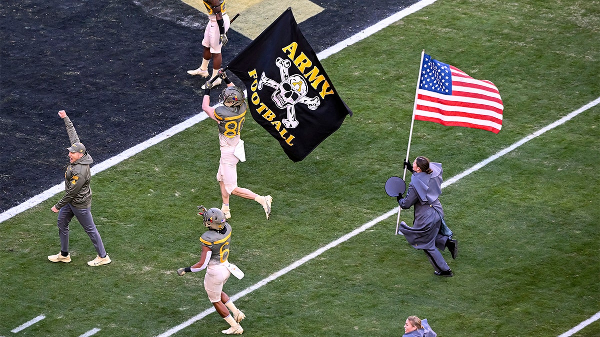 Jeff Monken leads Army onto the field