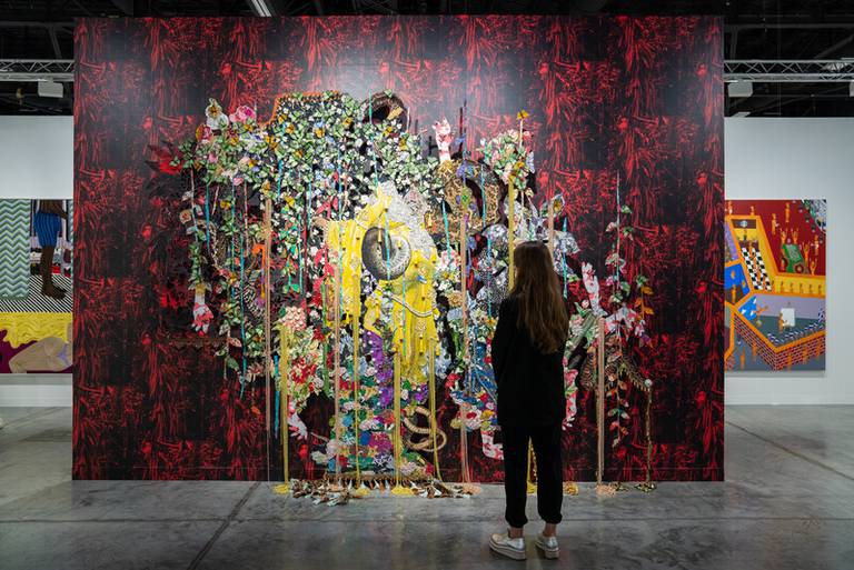 A guest views artwork at an Art Basel show.