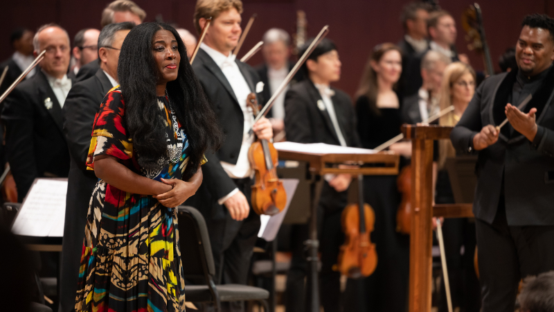 Compooser Chanda Dancy takes a bow after performance of her "Cacophony of Spirits" by the ASO and guest conductor Anthony Parnther. (credit: Rand Lines)