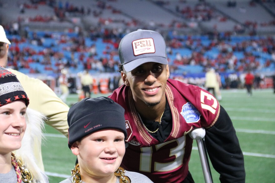 Jordan Travis, FSU’s star QB, suffered a severe leg injury during the last home game of the season. Travis’ injury called for reconstructive surgery, as he was forced to sit out for the remainder of the season. But head football coach Mike Norvell and the Noles were still able to pick up wins with their victory in the the ACC title game against Louisville., Dec. 2, 2023 (WFSU/David Mullins)