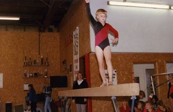 A young girl does gymnastics 