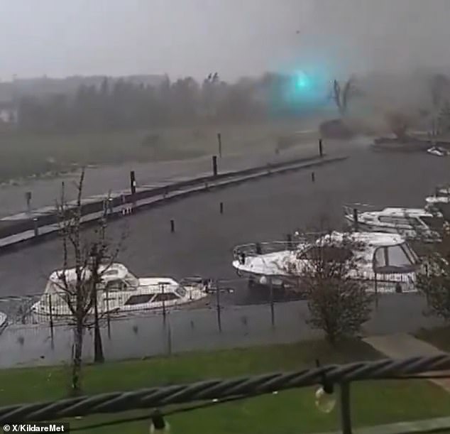 A video shared on X showed the possible tornado making its way past anchored boats and causing flashes of blue light