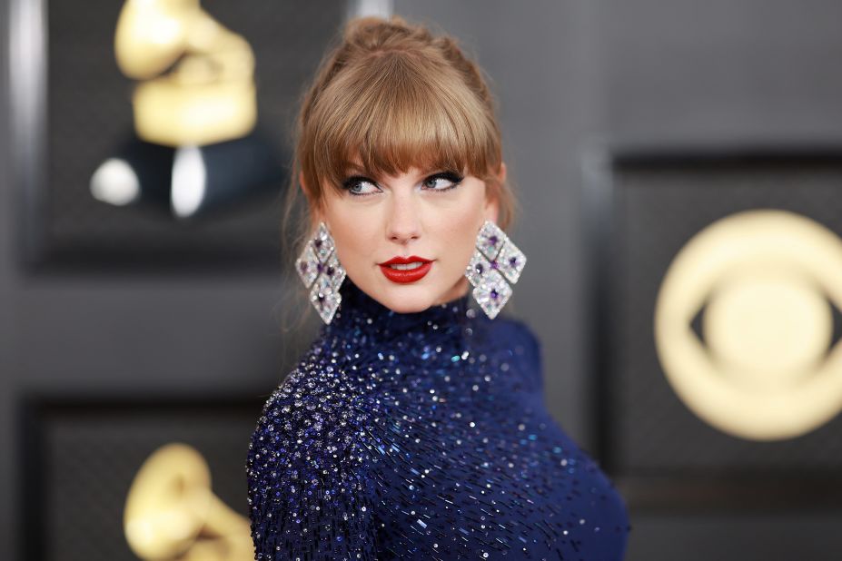 Swift channels her recent album "Midnights" with a shimmering blue ensemble. 