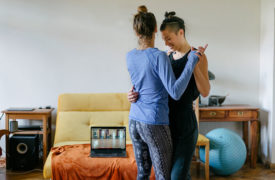 A couple slow dances in their living room.