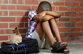 boy sad at school from bullying