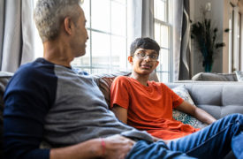 teen with parent talk on couch