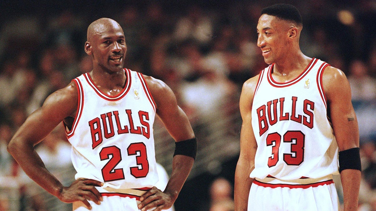 Michael Jordan and Scottie Pippen talk during a Bulls game