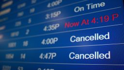 A flight information display system shows departure times at the Ronald Reagan Washington National Airport on December 27, 2021 in Arlington, Virginia. 