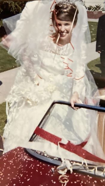 <strong>Wedding dress: </strong>Jerilyn's friend Genie made her wedding dress for her. Later, Genie wore it at her wedding, and then Genie's sister wore it at her wedding. Jerilyn now has the dress in her home as a memento of many happy days.