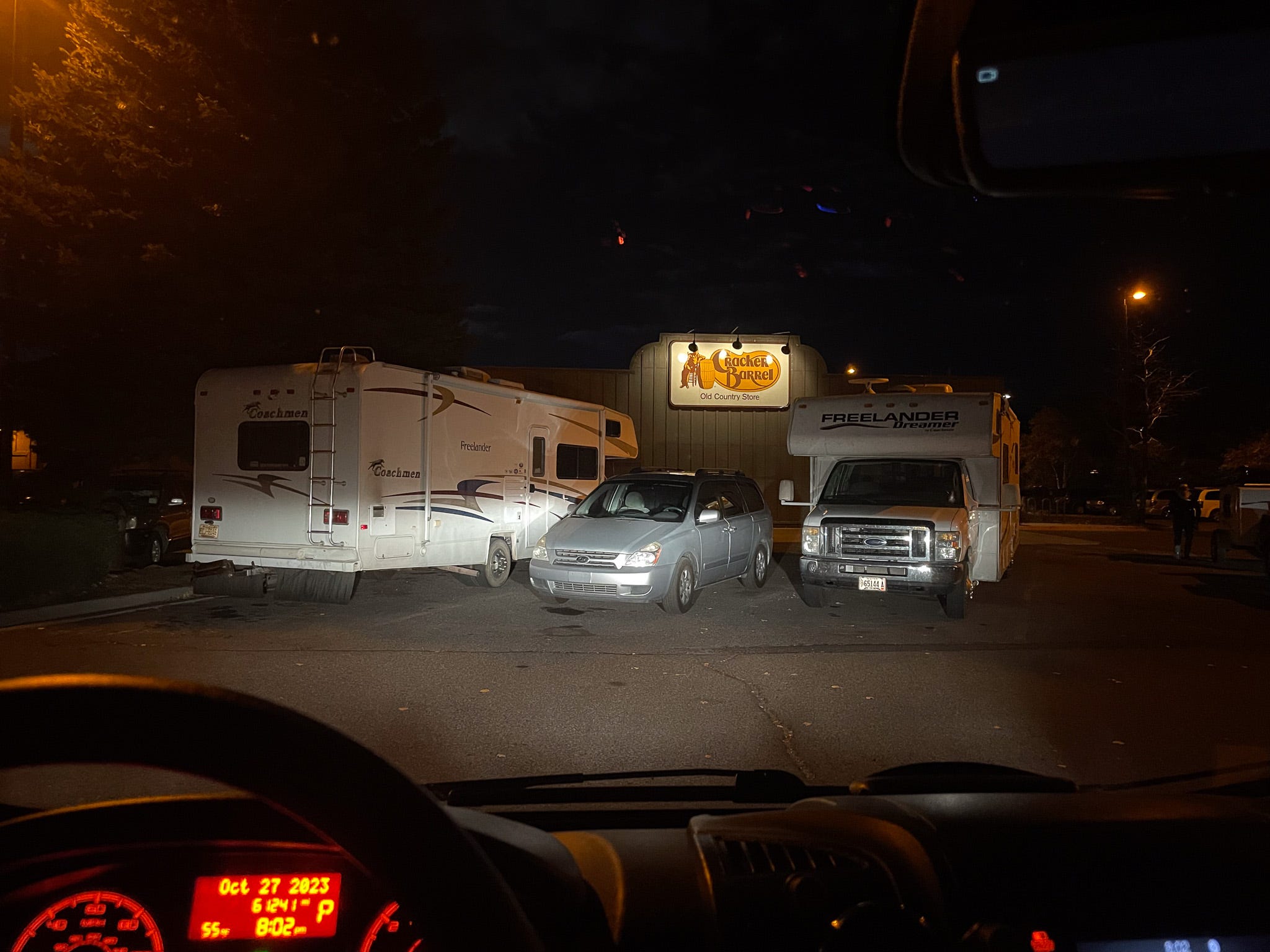 A view of the Cracker Barrel parking lot at night.