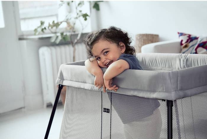 a child in the travel crib