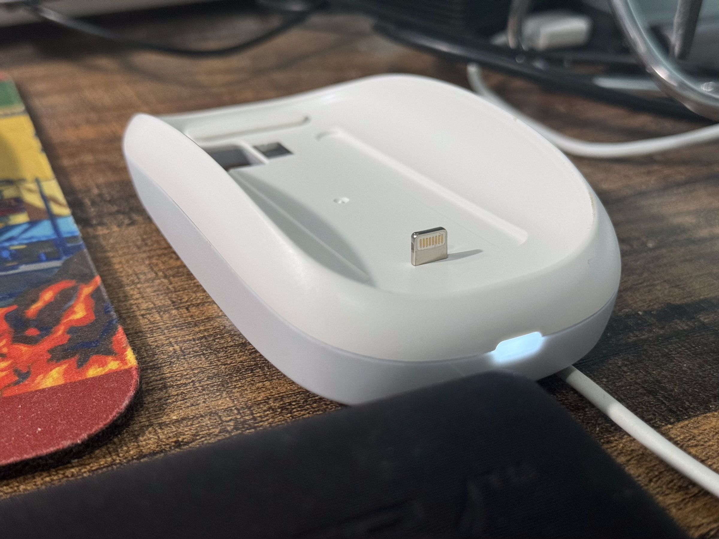 A picture of the Tatofy Grip without the Magic Mouse shows the Lightning adapter that’s built into it.