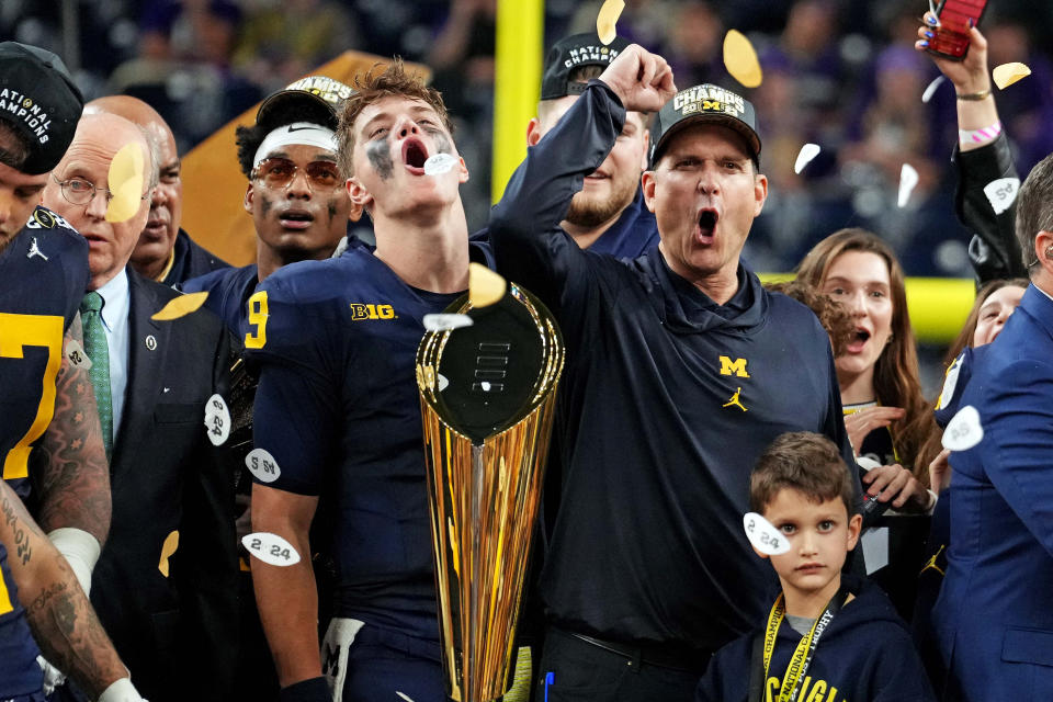 Jan 8, 2024; Houston, TX, USA; Michigan Wolverines wide receiver Cornelius Johnson (6) and head coach Jim Harbaugh celebrate after beating the Washington Huskies in the 2024 College Football Playoff national championship game at NRG Stadium. Mandatory Credit: Kirby Lee-USA TODAY Sports