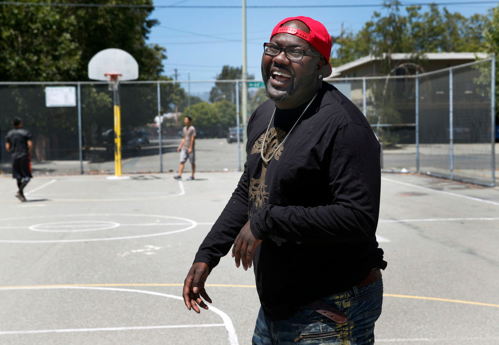 Rapper Mistah F.A.B. shoots hoops at Linden Community Park, where he spent his days as a youth, in Oakland, Calif. on Wednesday, June 29, 2016