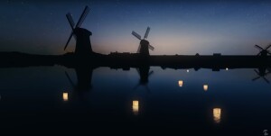 Lanterns float on the water and pass a couple of windmills at sunset.