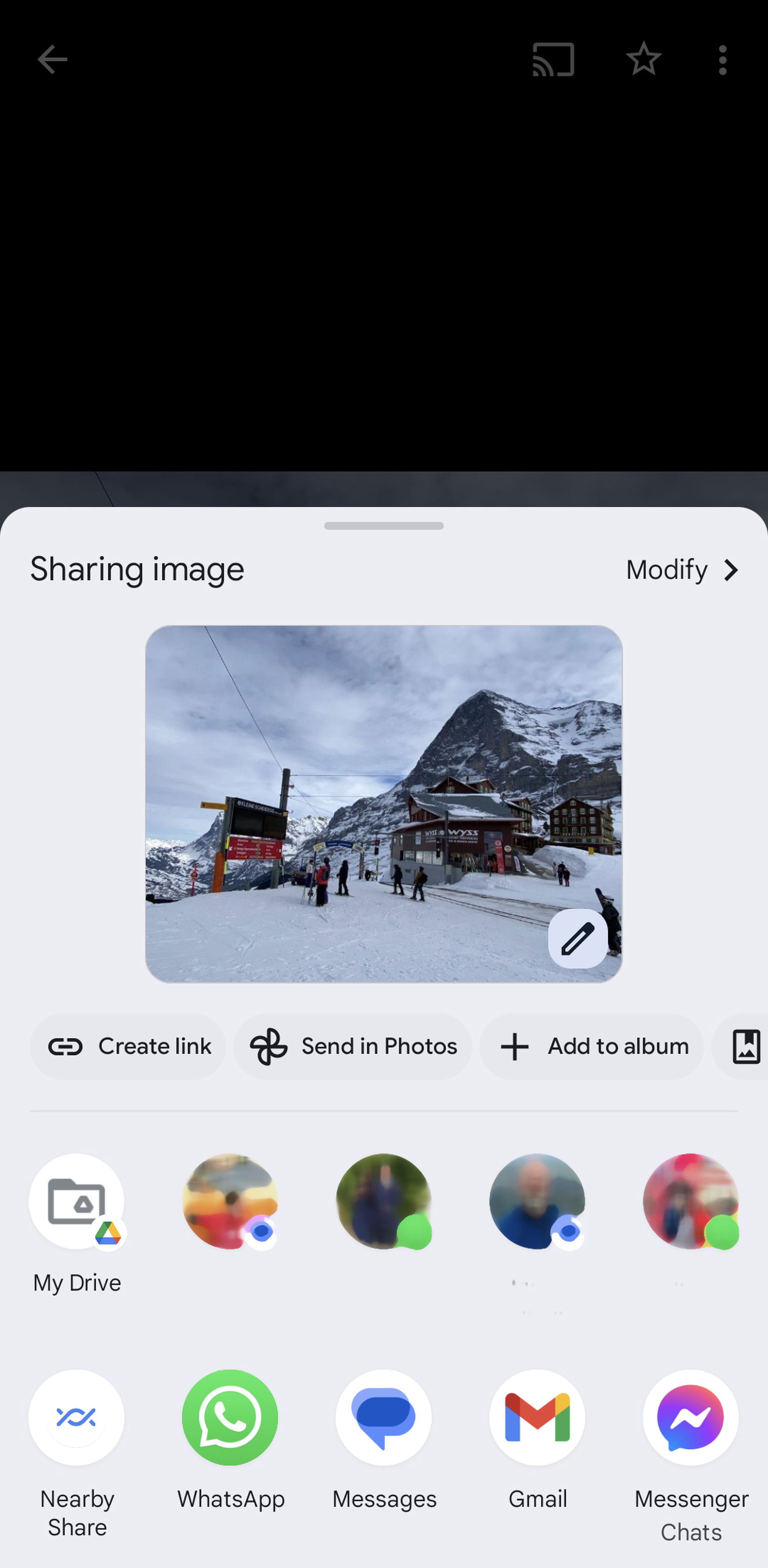 Pop-up menu with Sharing image on top, a photo of a snowscape below that, and several choices below that.