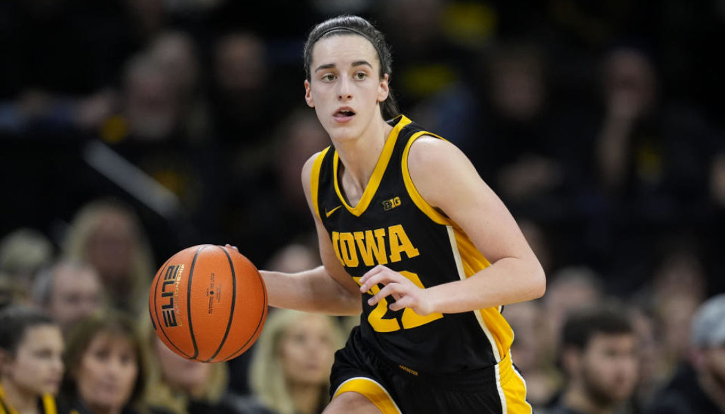 Iowa's Caitlin Clark OK after court-storming Buckeyes fan knocked her down following Ohio State upset - Yahoo Sports