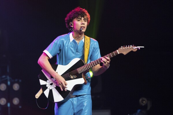 FILE - DannyLux performs at the Coachella Music & Arts Festival in Indio, Calif., on April 14, 2023. Regional Mexican music has become a global phenomenon, topping music charts, breaking streaming records and reaching new audiences as it crosses borders. (Photo by Amy Harris/Invision/AP, File)